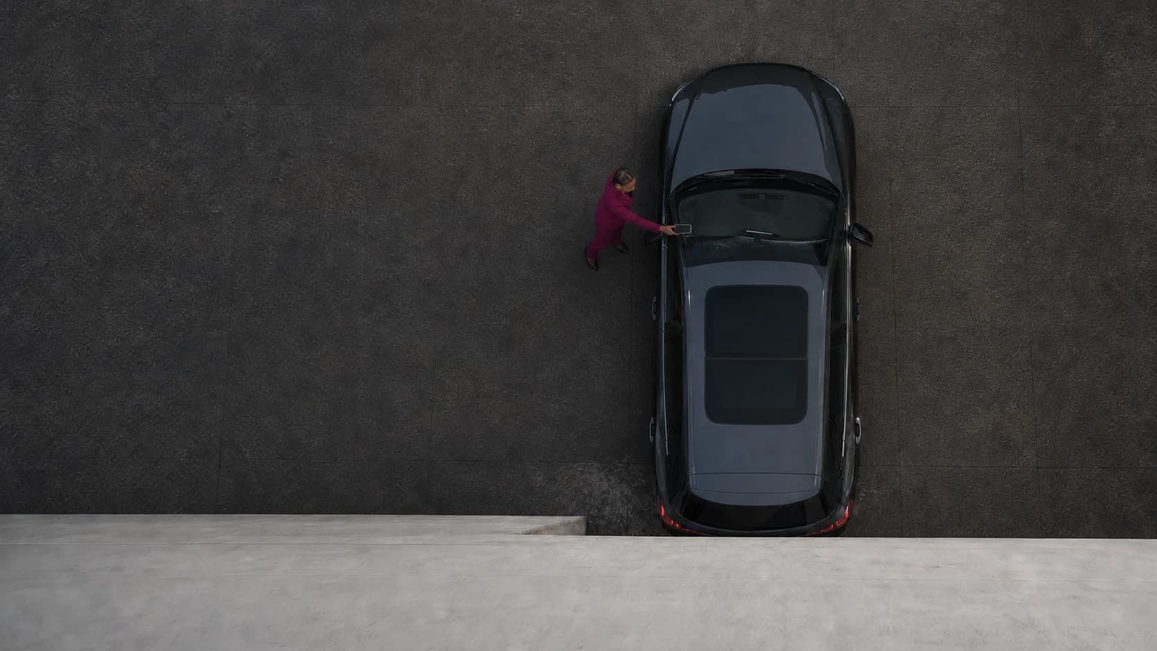 Overhead view of a person using Halo to identify a vehicle from the windshield VIN plate.