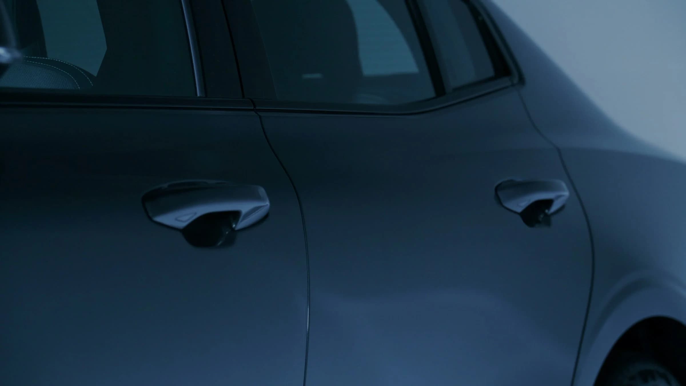Real graphite vehicle profile photographed in a controlled studio environment.
