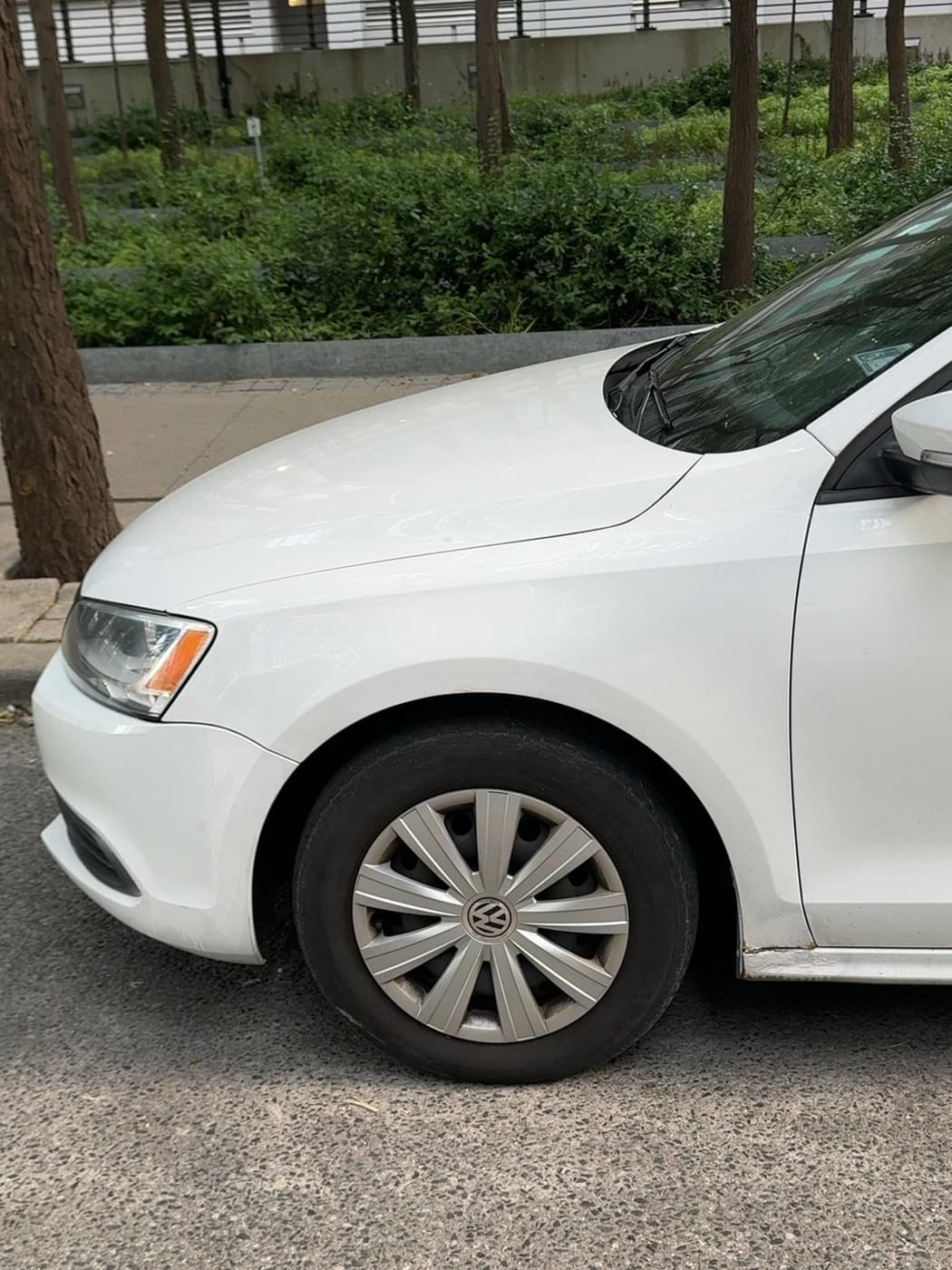 White Jetta front wheel source capture